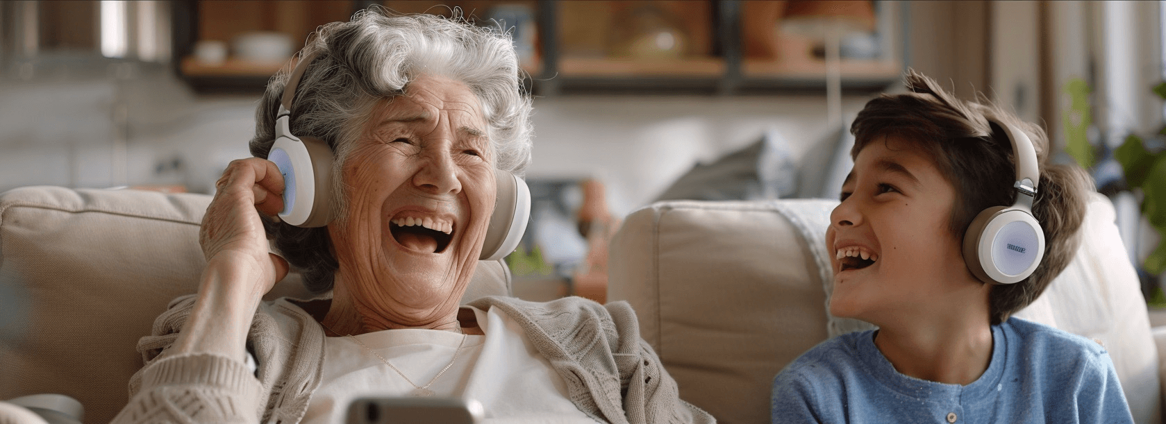 Two people smiling while looking at a phone